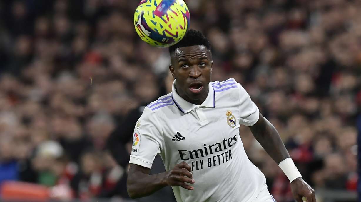 Real Madrid's Vinicius Junior controls the ball during the Spanish La Liga soccer match between Athletic Club Bilbao and Real Madrid at the San Mames stadium in Bilbao, Spain, Sunday, Jan. 22, 2023.