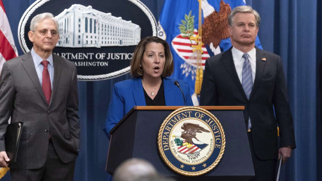 Deputy Attorney General Lisa Monaco flanked by Attorney General Merrick Garland, left, and FBI Director Christopher Wray, speaks during a news conference to announce an international ransomware enforcement action, in Washington, Thursday. The FBI has seized the website of a prolific ransomware gang that has heavily targeted hospitals and other healthcare providers.
