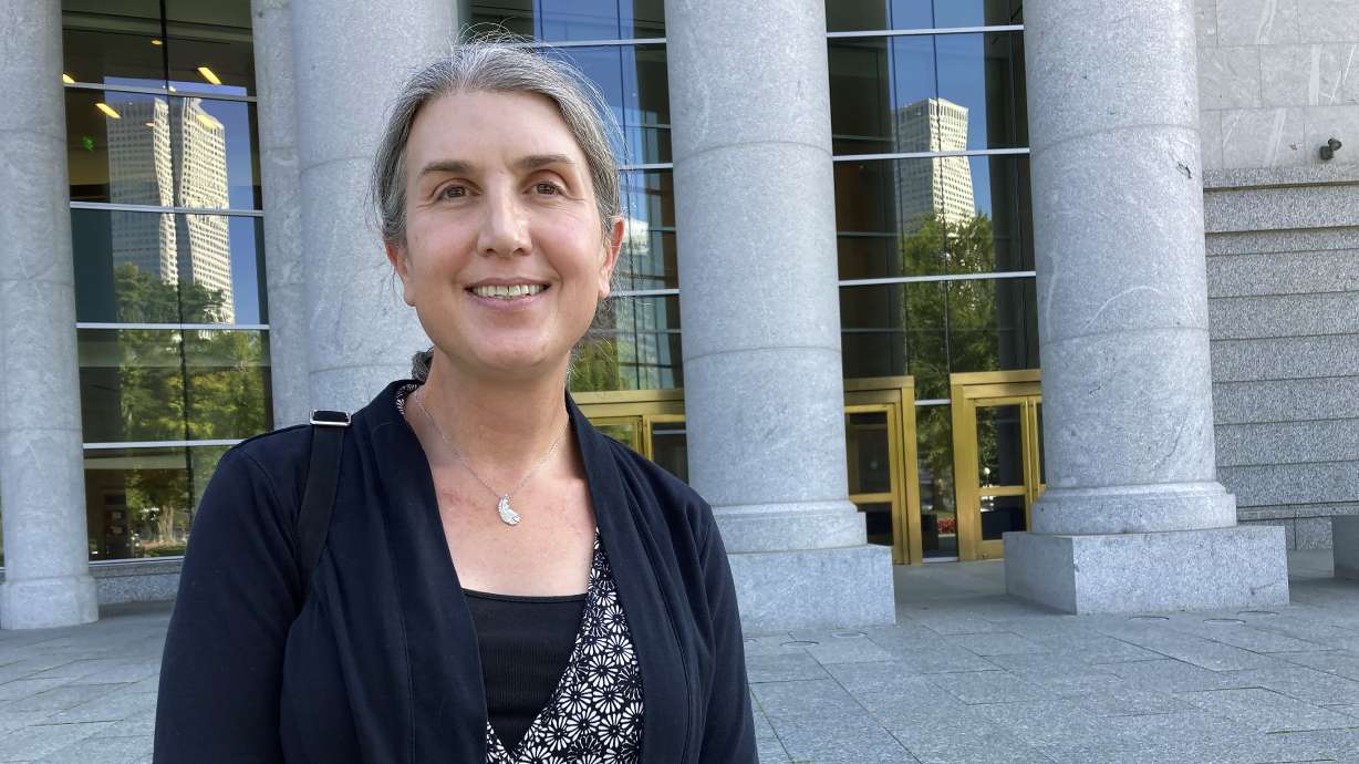 Colorado lawyer Autumn Scardina poses for photos outside the Ralph Carr Colorado Judicial Center in Denver, Oct. 5, 2022. Scardina, who is transgender, sued Colorado baker Jack Phillips after he refused to make her a cake intended to celebrate her gender transition.