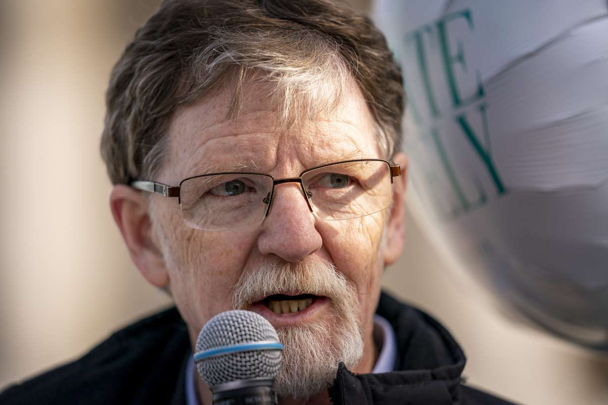 Jack Phillips, who's case was heard by the Supreme Court five years ago after he objected to designing a wedding cake for a gay couple, speaks to supporters outside the Supreme Court in Washington, Dec. 5, 2022.