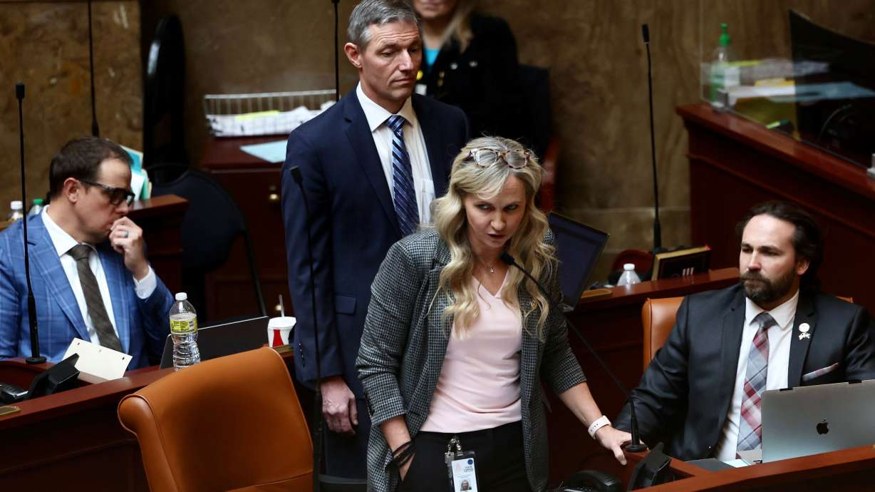 Rep. Katy Hall, R-Ogden, speaks on the House floor regarding a ban on transgender surgeries and limit puberty blockers on Thursday. Behind her is Sen. Michael Kennedy, R-Alpine. The full Utah House voted on Thursday to approve a bill that would ban sex reassignment surgeries for Utah children and teens.