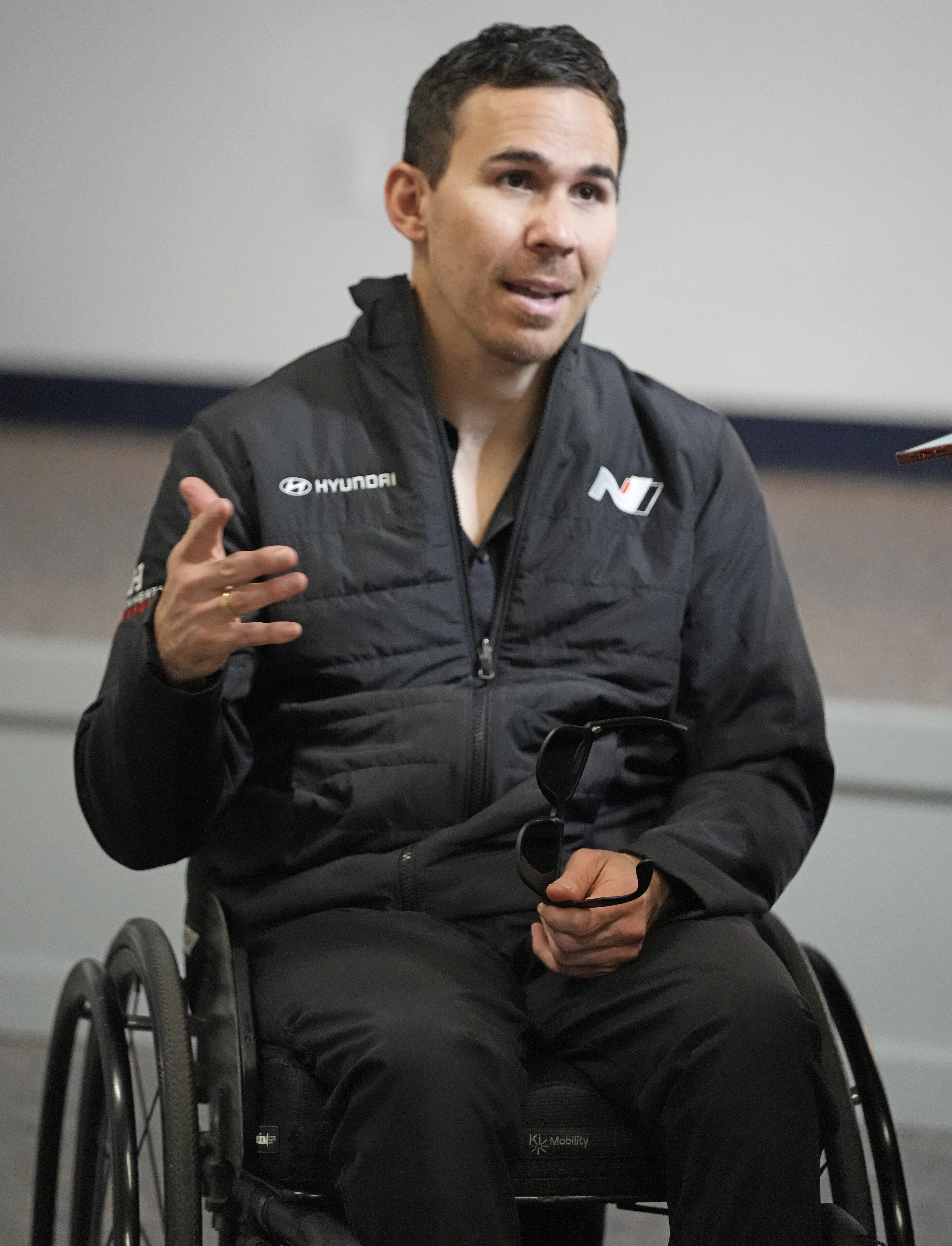 Robert Wickens answers questions during an interview prior to the Rolex 24 hour auto race at Daytona International Speedway, Thursday, Jan. 26, 2023, in Daytona Beach, Fla. Bryan Herta wants to enter Wickens in the Indianapolis 500 as early as 2024. That's even a year longer than preferred because of the work required on the hand control system needed for the paralyzed driver. 