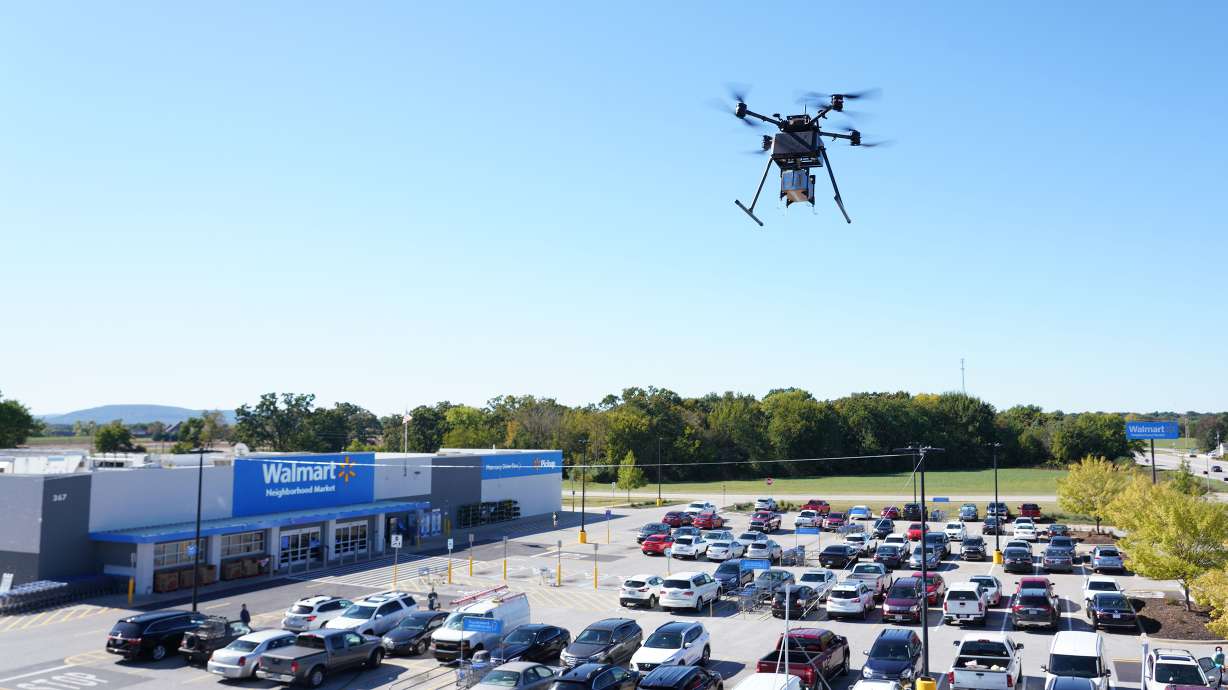 A drone at a Walmart in Farmington, Arkansas, flies out to deliver a package. Walmart recently brought its drone delivery service to two Utah locations.