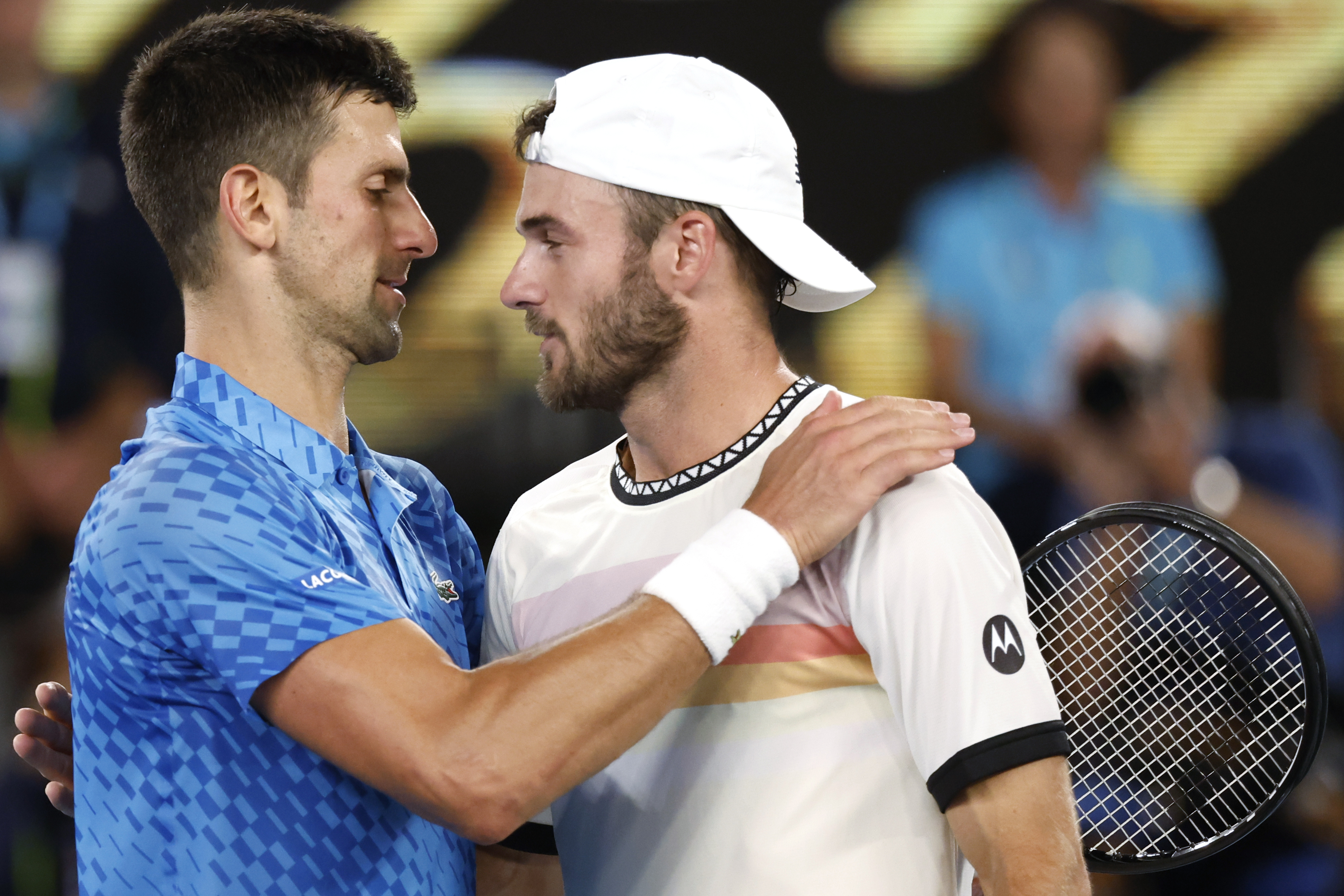 Novak Djokovic, left, of Serbia is congratulated by Tommy Paul of the U.S. after their semifinal at the Australian Open tennis championship in Melbourne, Australia, Friday, Jan. 27, 2023. 