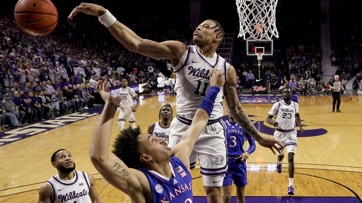 Kansas State forward Keyontae Johnson (11) blocks a shot by Kansas forward Jalen Wilson (10) during the first half of an NCAA college basketball game Tuesday, Jan. 17, 2023, in Manhattan, Kan.
