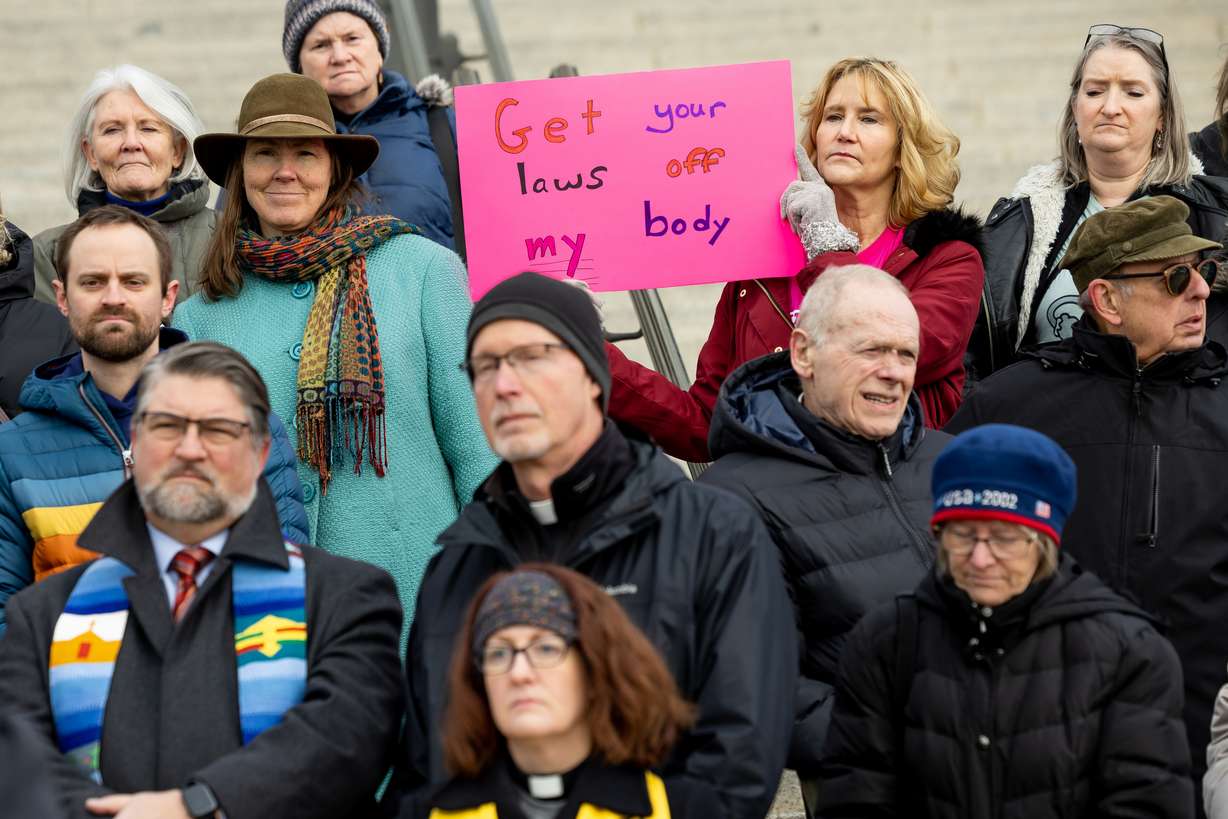 Marilyn Smith, of the South Valley Unitarian Universalist Society, holds a sign while standing with other faith leaders who are filing an amicus brief in support of Planned Parenthood Association of Utah in its lawsuit challenging Utah’s abortion ban at the Capitol in Salt Lake City on Thursday.