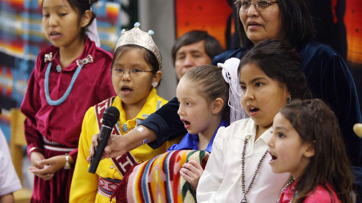 Rose Jakub and several children sing at the Adopt-A-Native-Elder office in Salt Lake City on Jan. 28, 2007. A state version of the federal Indian Child Welfare Act was tabled by lawmakers in a committee meeting Thursday with a 7-5 vote.