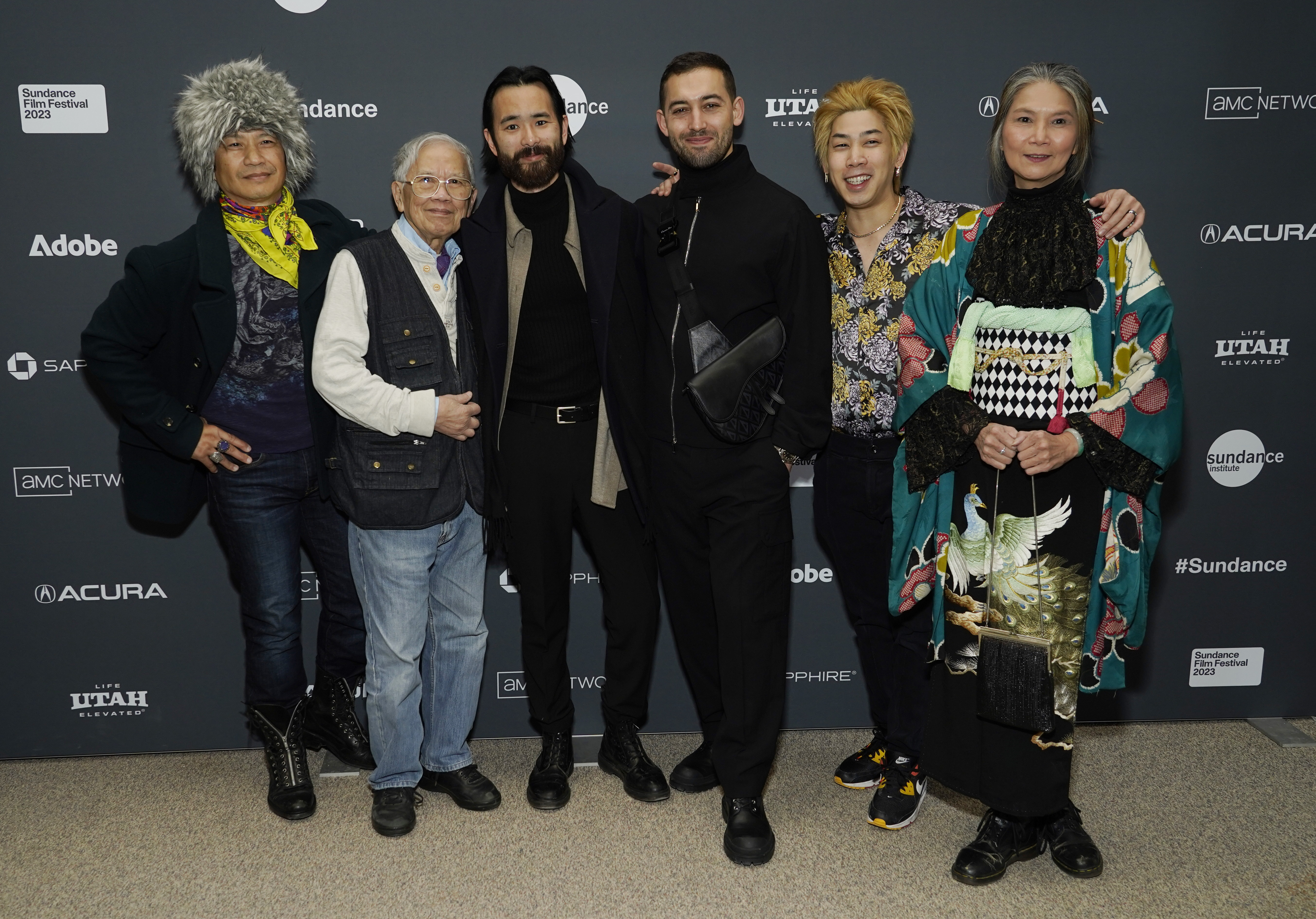 Sing J. Lee, third from left, director/co-writer of "The Accidental Getaway Driver," poses with cast members, from left, Dustin Nguyen, Hiep Tran Nghia, Dali Benssalah, Phi Vu and Gabrielle Chan at the premiere of the film at the 2023 Sundance Film Festival, Monday,  in Park City.