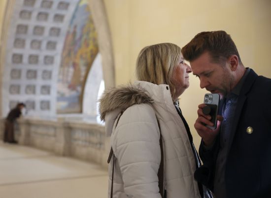 Sue Robbins, a member of the Equality Utah Transgender Advisory Council, and Troy Williams, executive director of Equality Utah, confer after SB16 passed in the Senate at the Capitol in Salt Lake City on Friday. The Utah Senate gave final legislative approval to SB16 that would ban transgender surgeries for Utah children and teens, as well as place an indefinite moratorium on new treatments including puberty blockers and cross-sex hormones for minors.