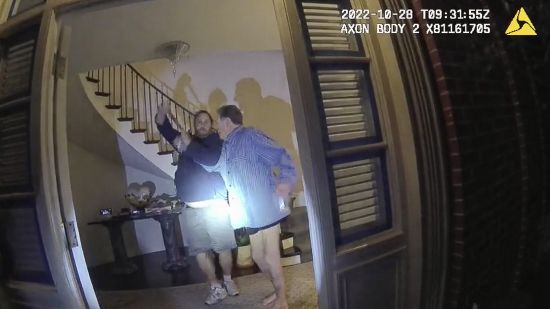 This image from video from police body-worn camera footage, released by the San Francisco Police Department, shows Paul Pelosi, right, fighting for control of a hammer with his assailant, David DePape, during a attack at Pelosi's home in San Francisco on Oct. 28, 2022.