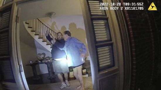 This image from video from police body-worn camera footage, released by the San Francisco Police Department, shows Paul Pelosi, right, fighting for control of a hammer with his assailant, David DePape, during a attack at Pelosi's home in San Francisco on Oct. 28, 2022.