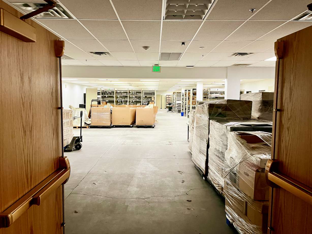 Manuscripts, photo plates and other Utah history collection objects are stored inside a large room at a state facility in Midvale on Jan. 27. The facility is one of five temporary homes before the vast collection is moved to a new museum and facility at the Utah Capitol as early as mid-2025.