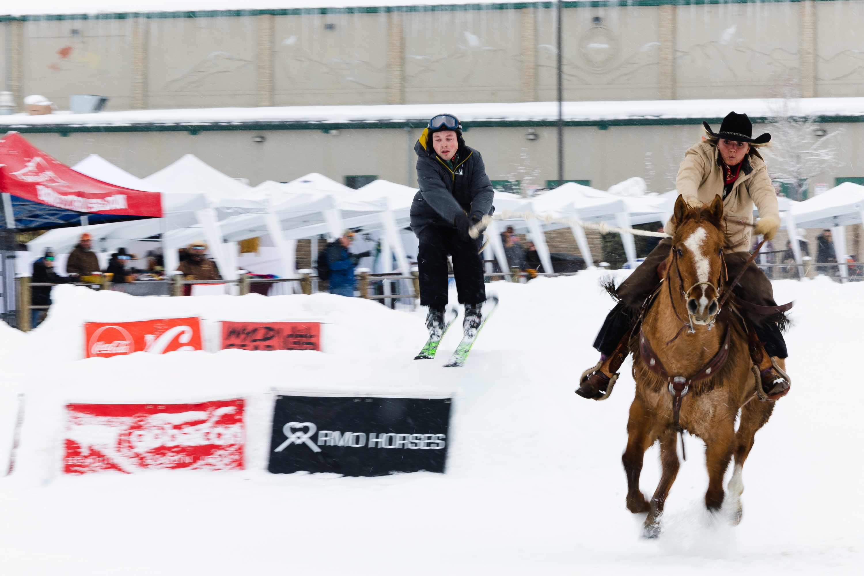 A participant prepares to make a jump during a skijoring competition at the Wasatch County Events Center in Heber City on Saturday.
