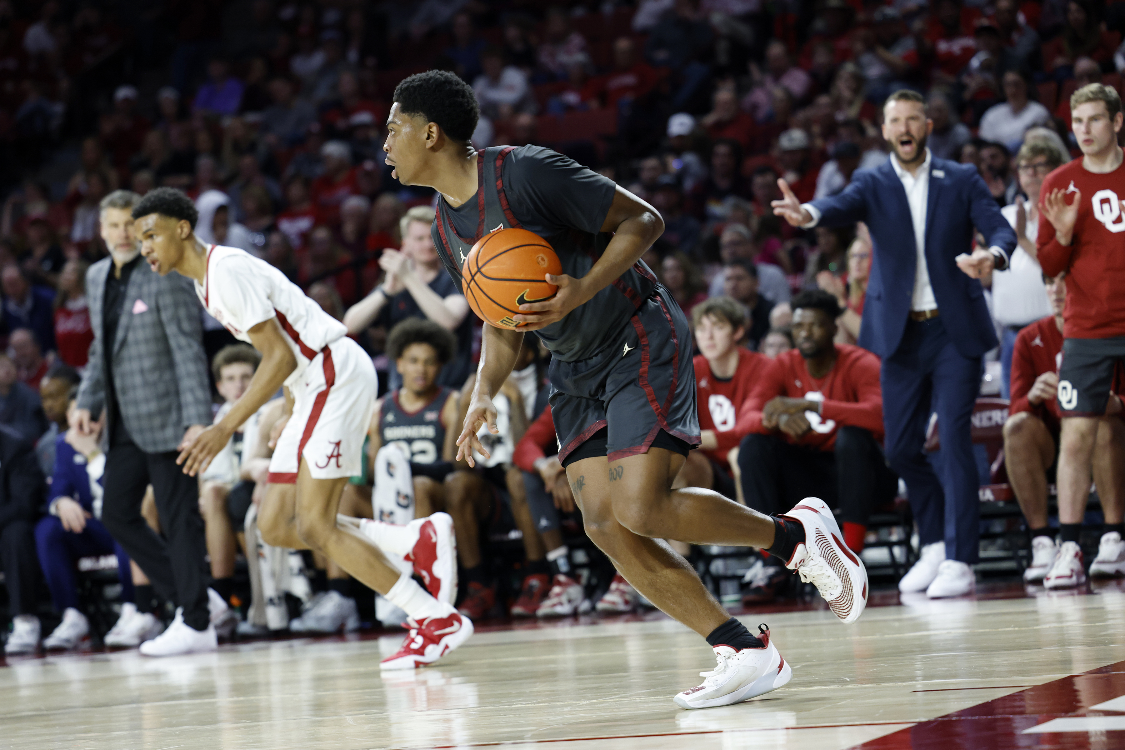 Oklahoma guard Grant Sherfield (25) brings the ball up the court during the first half of an NCAA college basketball game against Alabama, Saturday, Jan. 28, 2023, in Norman, Okla. 
