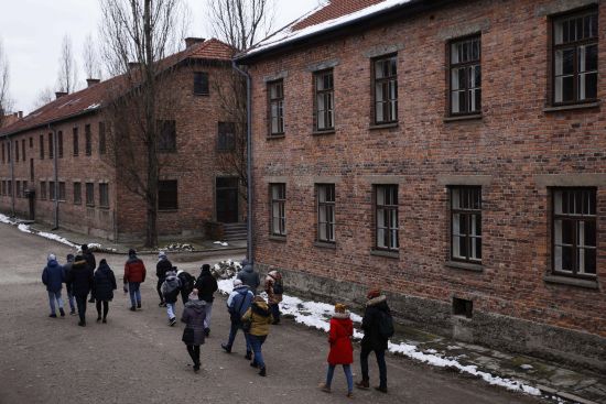 People visit the former Nazi German concentration and extermination camp Auschwitz-Birkenau in Oswiecim, Poland, Thursday. Survivors of Auschwitz-Birkenau gathered to commemorate the 78th anniversary of the liberation of the Nazi German death camp. The camp was liberated by Soviet troops on Jan. 27, 1945.