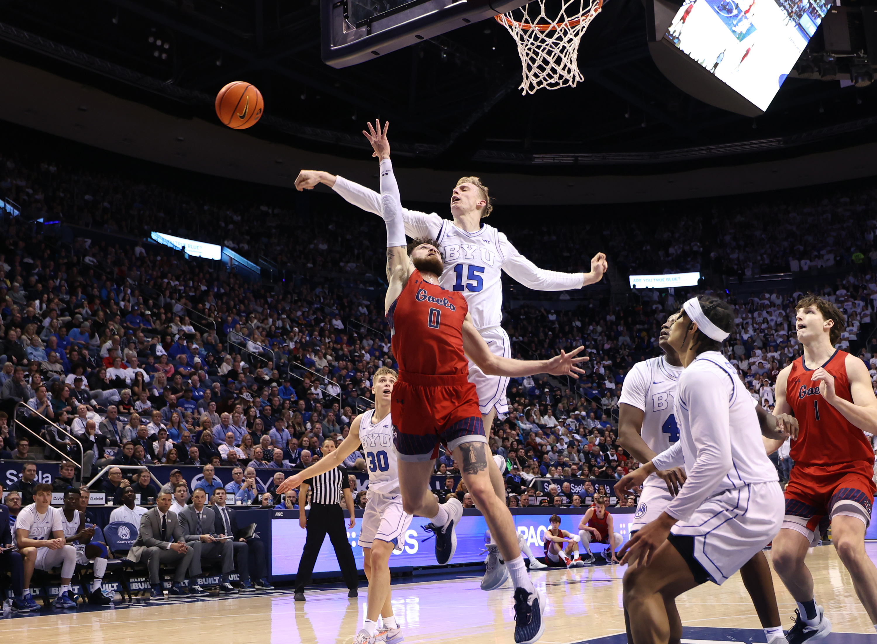 Brigham Young guard Richie Saunders (15) blocks the ball out of bounds on Saint Mary's guard Logan Johnson (0) as BYU and Saint Mary’s play at the Marriott Center in Provo on Saturday, Jan. 28, 2023.