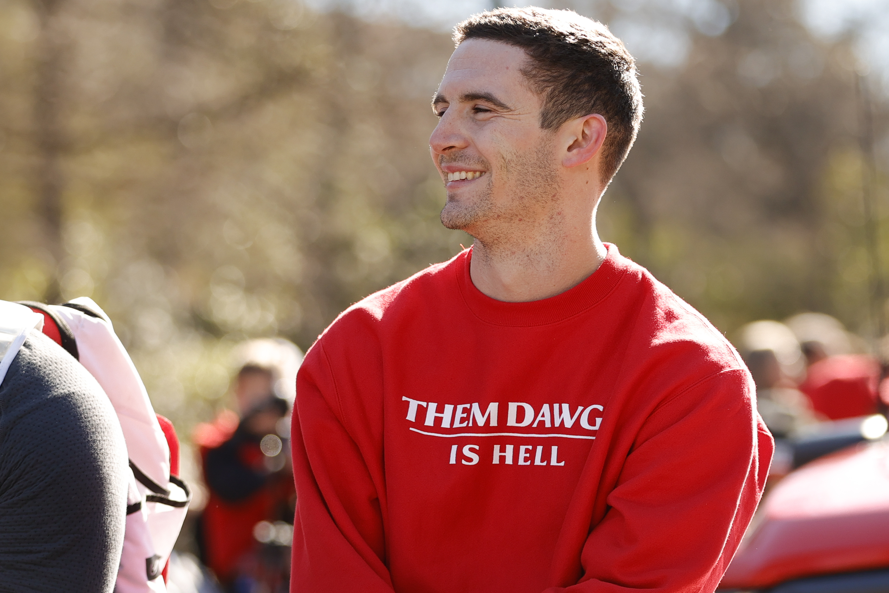 Georgia quarterback Stetson Bennett smiles at the crowd during a parade celebrating the Bulldog's second consecutive NCAA college football national championship, Saturday, Jan. 14, 2023, in Athens, Ga. 