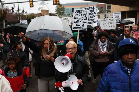 People protest after the release of the body camera footage showing police officers beating Tyre Nichols, who then died three days later after he was pulled over while driving during a traffic stop by Memphis police officers, in downtown Memphis, Tennessee, on Saturday.