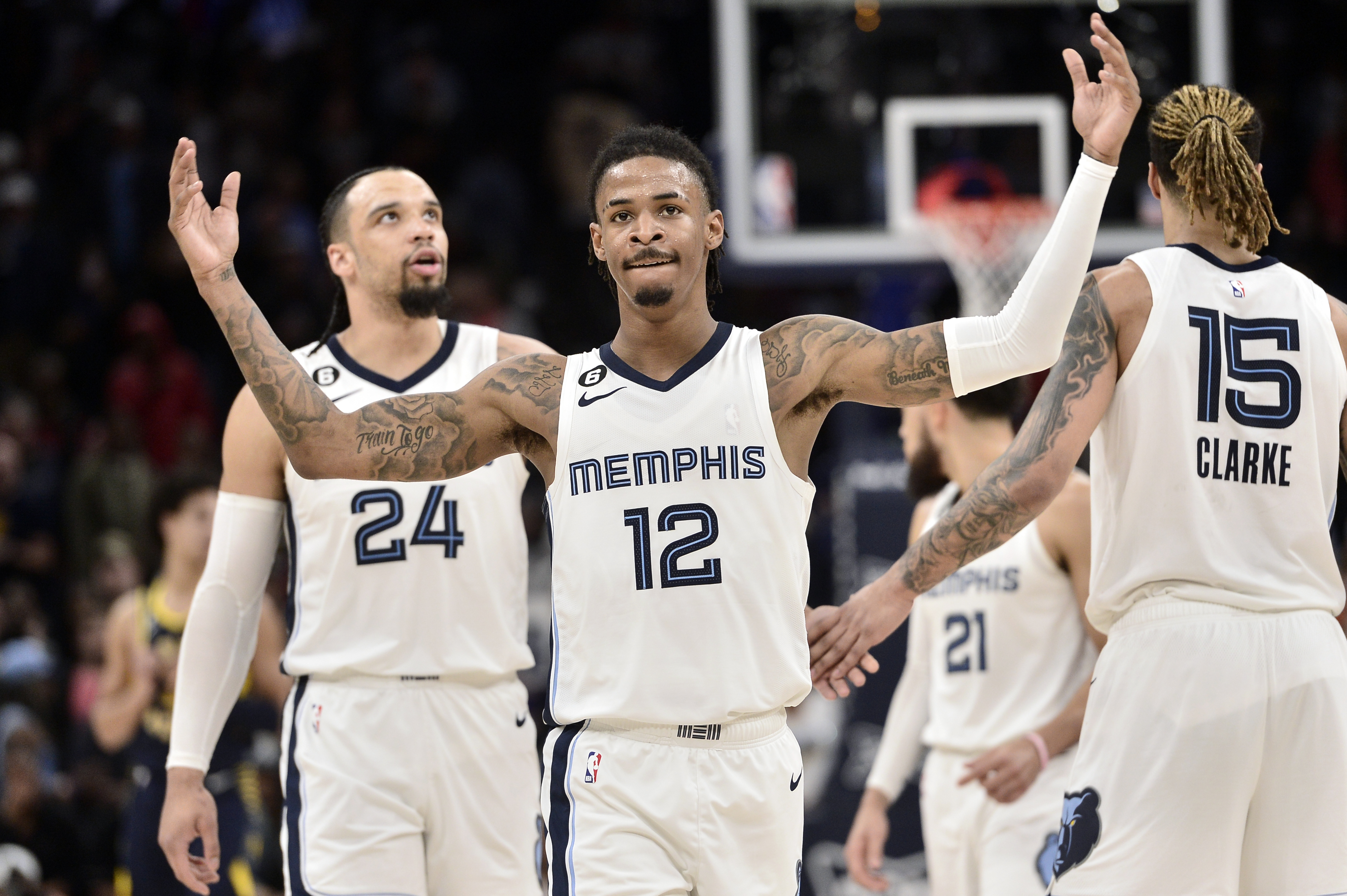 Memphis Grizzlies guard Ja Morant (12) reacts in the second half of an NBA basketball game against the Indiana Pacers, Sunday, Jan. 29, 2023, in Memphis, Tenn. 