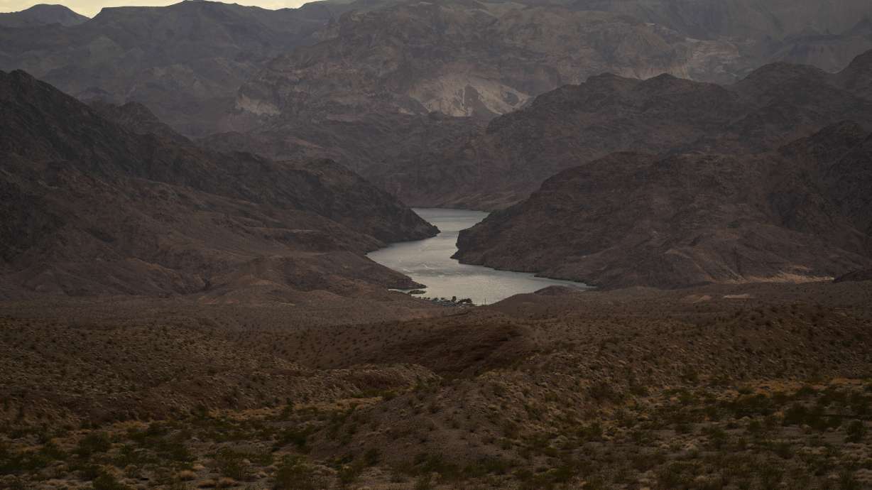 Water flows down the Colorado River on Aug. 14, 2022, More than 10% of the water carried by the Colorado River evaporates, leaks or spills as the 1,450-mile river flows through the region’s dams, reservoirs and open-air canals.