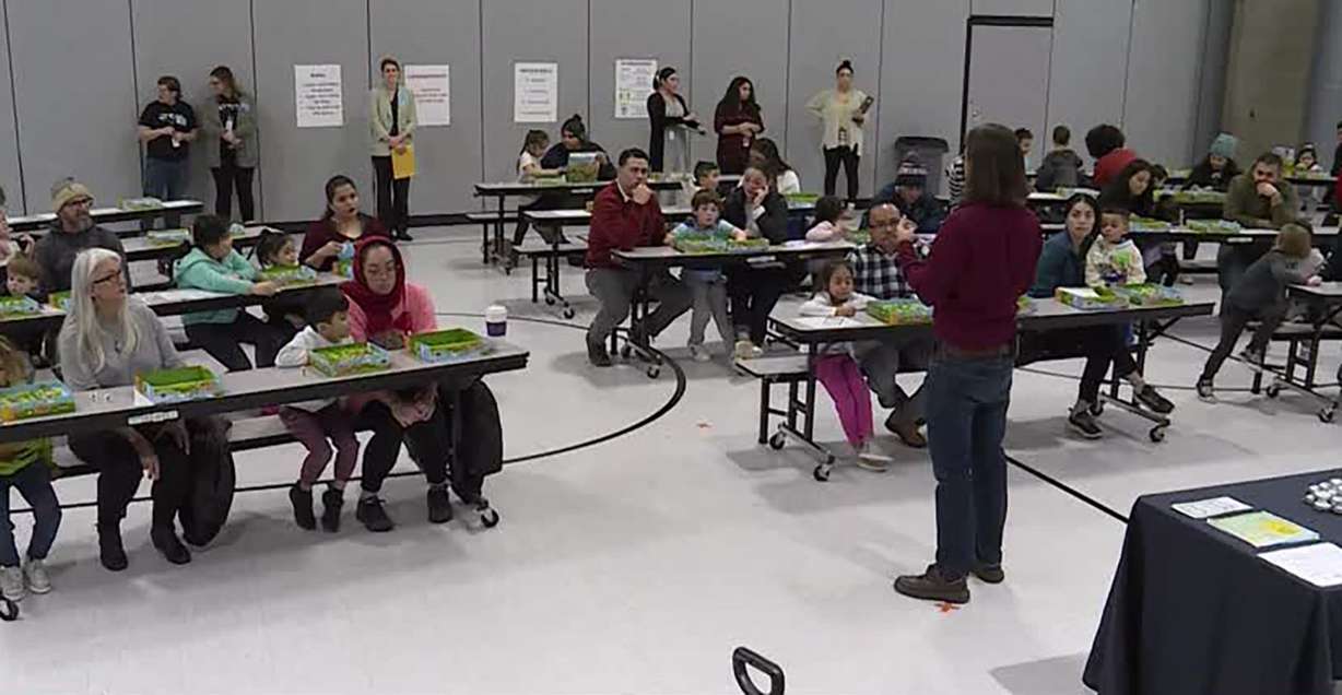 Dozens of parents and their preschoolers pack the gymnasium at Liberty Elementary School in Salt Lake City, Friday, for an event put on by the Utah STEM Action Center.
