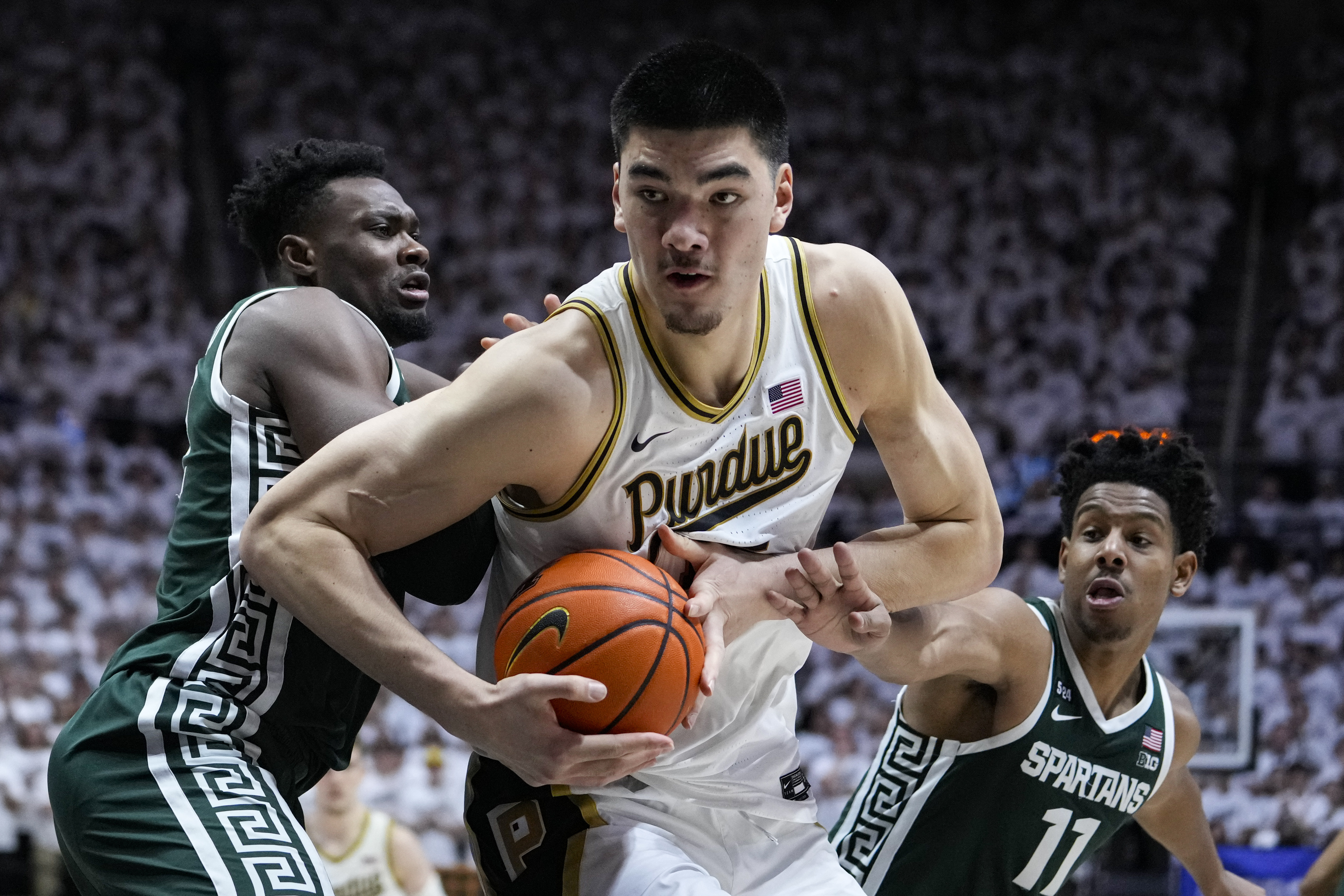 Purdue center Zach Edey (15) moves to the basket between Michigan State center Mady Sissoko (22) and guard A.J. Hoggard (11)during the second half of an NCAA college basketball game in West Lafayette, Ind., Sunday, Jan. 29, 2023. Purdue defeated Michigan State 77-61. 