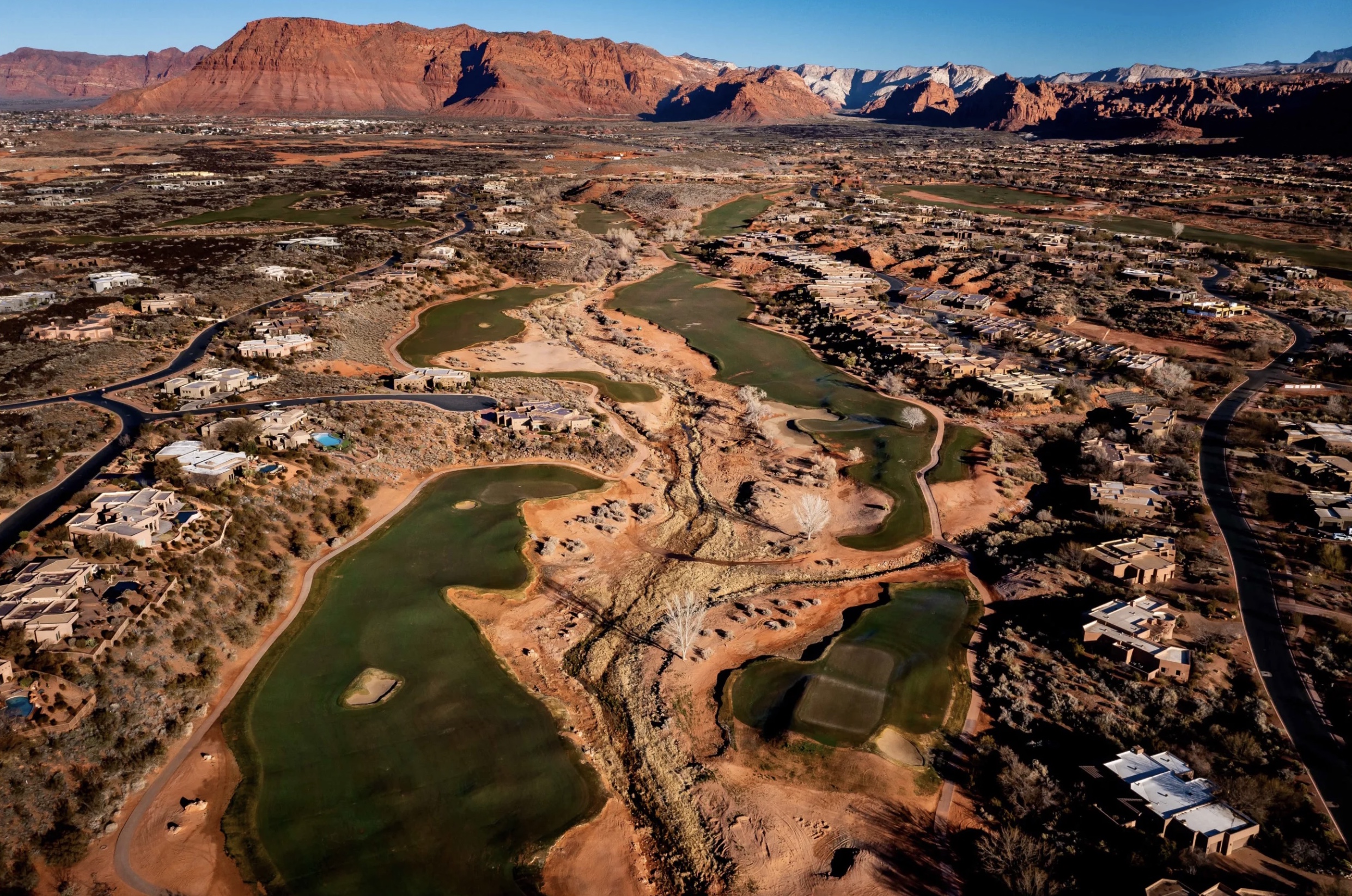 The Entrada at Snow Canyon golf course in St. George is pictured against a backdrop of red rock cliffs on Feb. 19, 2022. A bill requiring both public and privately owned golf courses to publish their annual water usage was held at the state capitol Wednesday after it was opposed by the golf industry. 