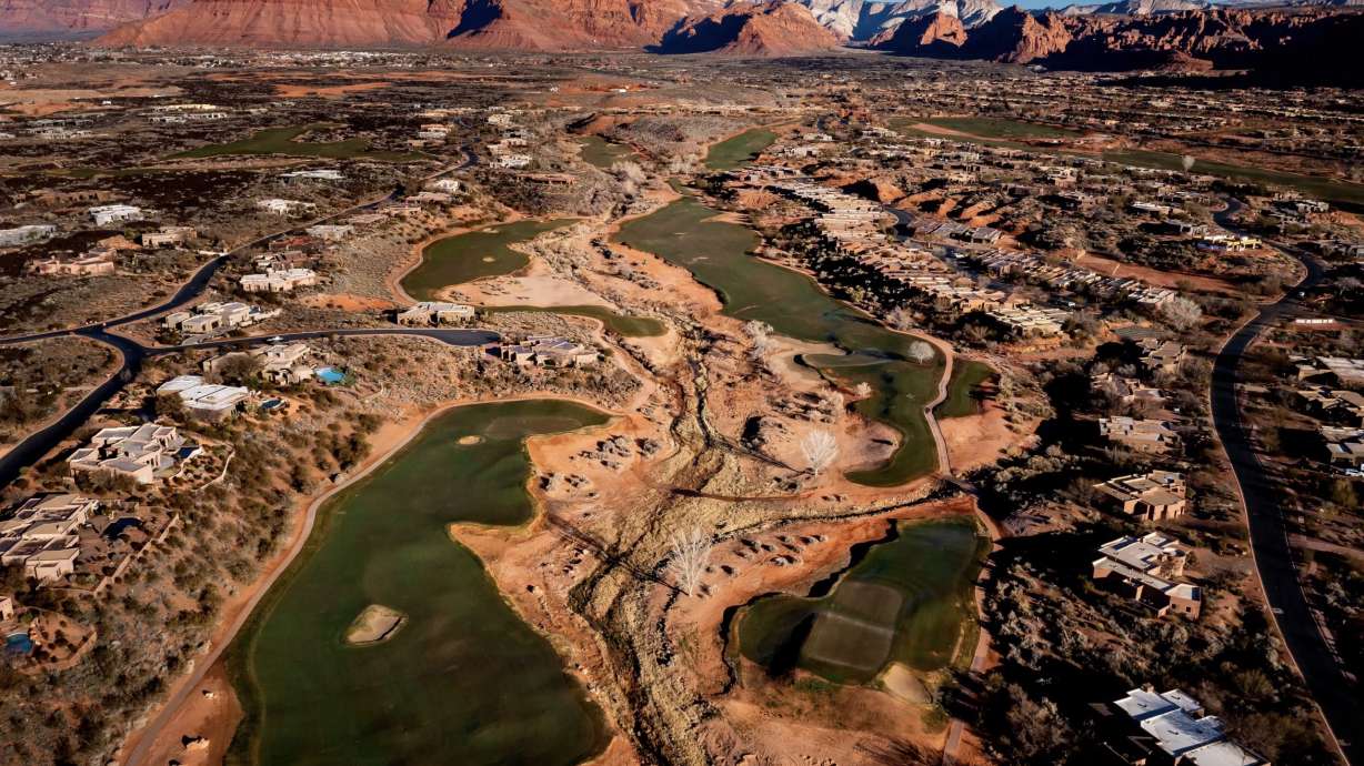 The Entrada at Snow Canyon golf course in St. George is pictured against a backdrop of red rock cliffs on Feb. 19, 2022. A bill requiring both public and privately owned golf courses to publish their annual water usage was held at the state capitol Wednesday after it was opposed by the golf industry.
