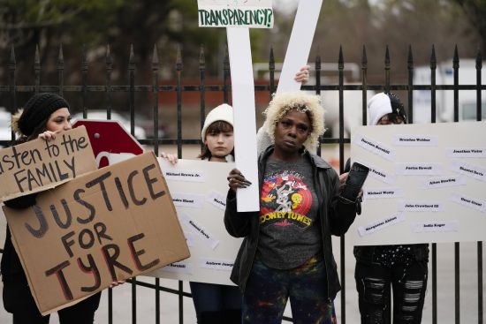 A group of demonstrators protest outside a police precinct in response to the death of Tyre Nichols, who died after being beaten by Memphis police officers, in Memphis, Tenn., Sunday. Two more Memphis police officers have been disciplined and three emergency responders fired.