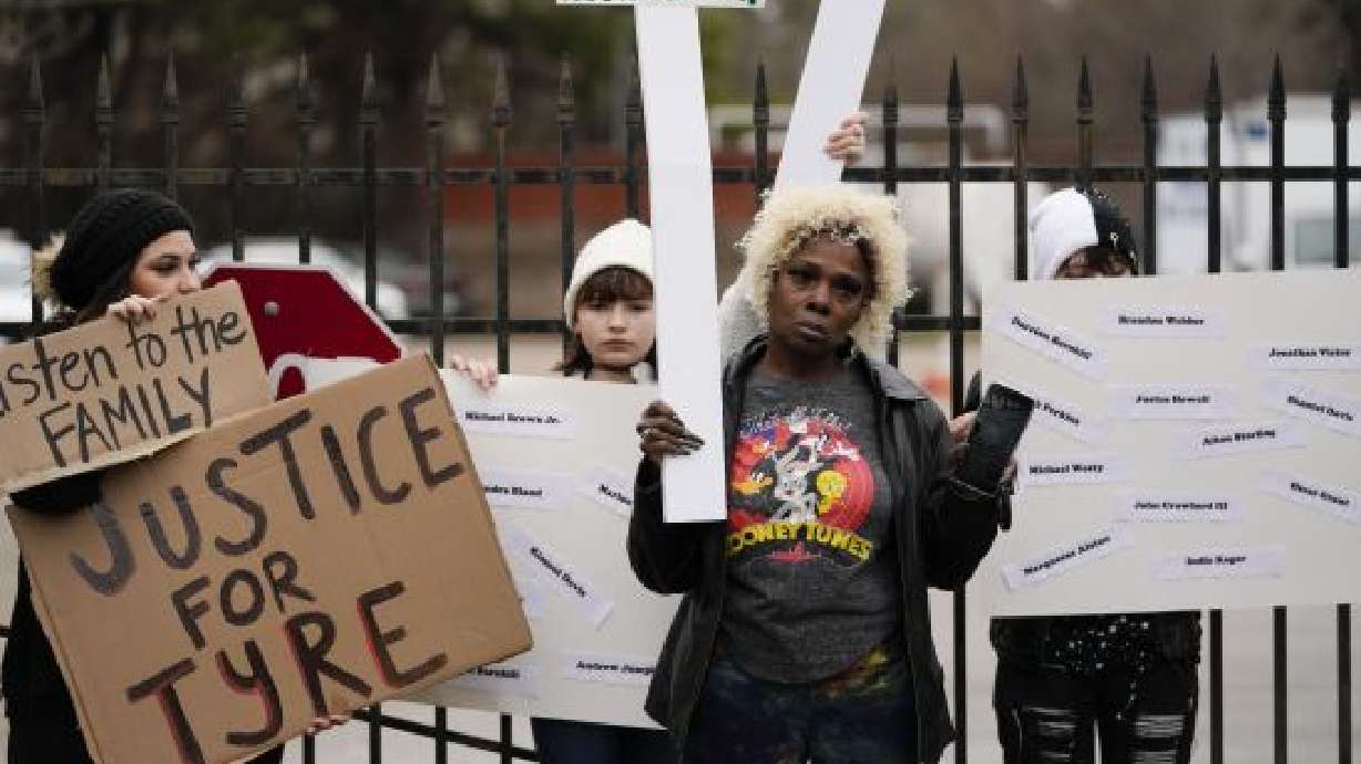 A group of demonstrators protest outside a police precinct in response to the death of Tyre Nichols, who died after being beaten by Memphis police officers, in Memphis, Tenn., Sunday. Two more Memphis police officers have been disciplined and three emergency responders fired.