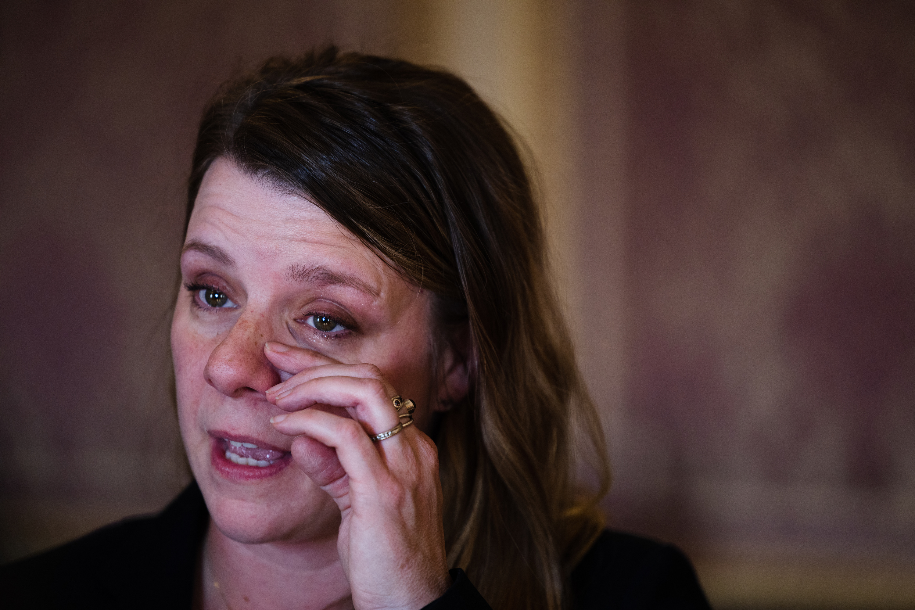 Nichole Schmidt, mother of Gabby Petito, wipes away a tear during a press conference for SB117, a bill advocating for domestic violence protections, at the Capitol in Salt Lake City on Monday.