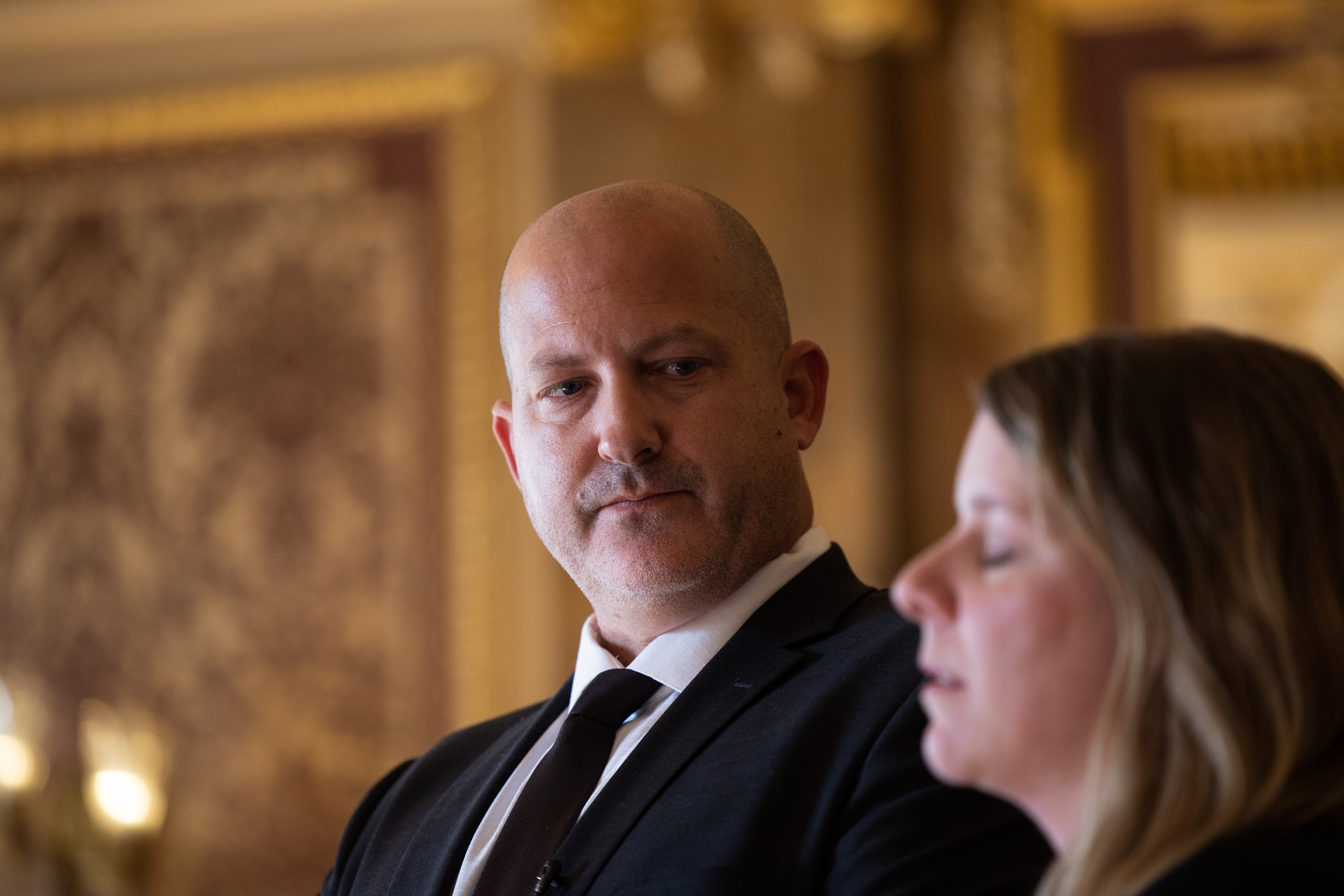 Joe Petito, father of Gabby Petito, looks at Nicole Schmidt during a press conference for an Utah bill advocating for domestic violence protections on Jan. 30, 2023. The parents are appealing the dismissal of a wrongful death lawsuit they filed against the Moab Police Department.