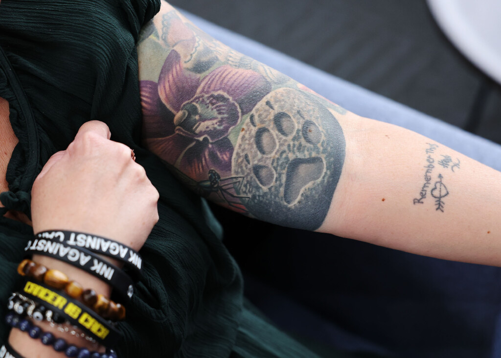 A tattoo worn by Ink Against Cancer founder Hildegard Koenig. The paw print is in memory of her late friend, "Wolf," who died from cancer in 2017.