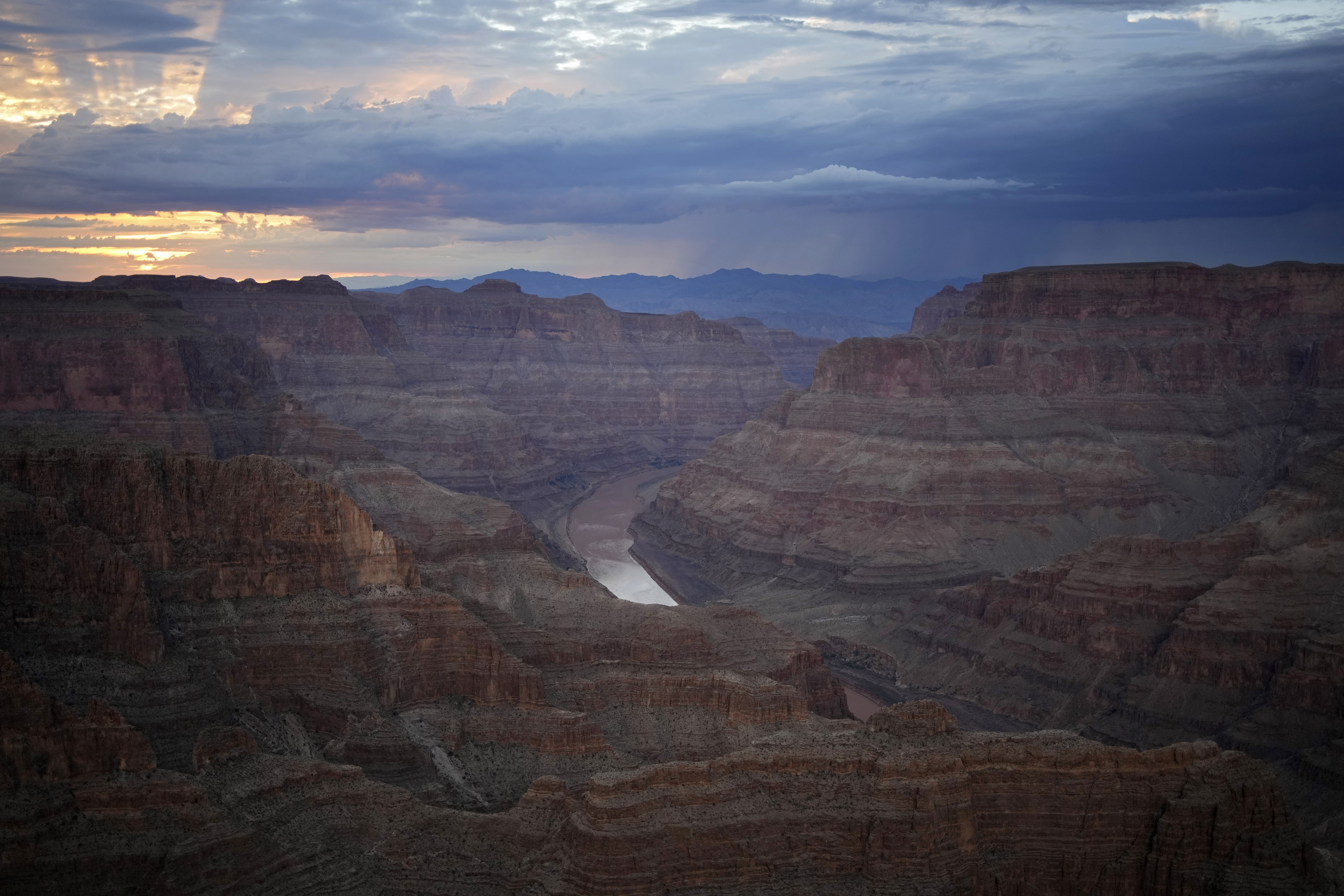 The Colorado River flows through the Grand Canyon on the Hualapai reservation Aug. 15, 2022, in northwestern Arizona. Six western states that rely on water from the Colorado River have agreed on a plan to dramatically cut their use. California, the state with the largest allocation of water from the river, is the holdout.