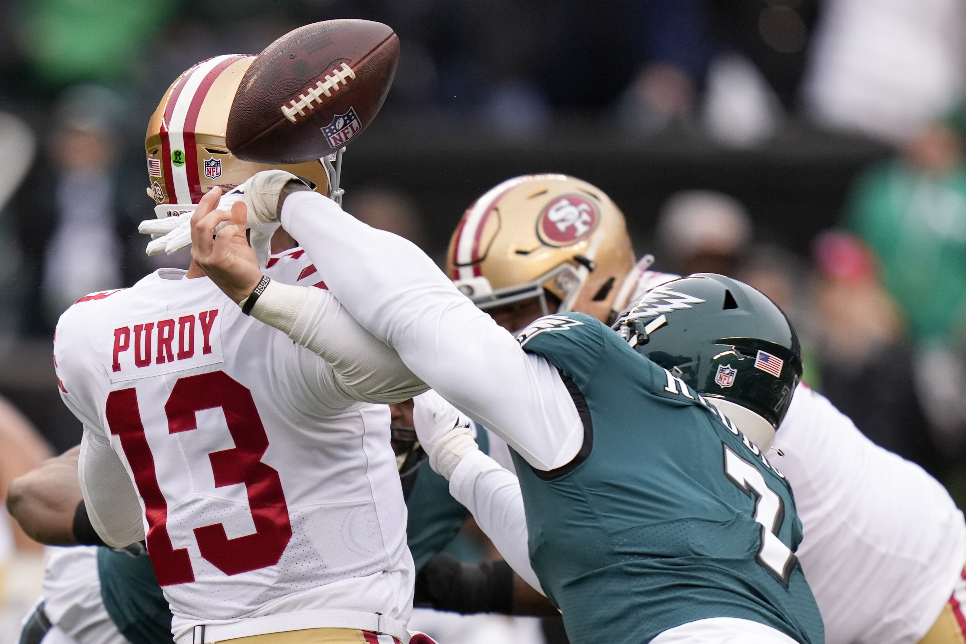 Philadelphia Eagles linebacker Haason Reddick, right, causes a fumble by San Francisco 49ers quarterback Brock Purdy during the first half of the NFC Championship NFL football game between the Philadelphia Eagles and the San Francisco 49ers on Sunday, Jan. 29, 2023, in Philadelphia. 