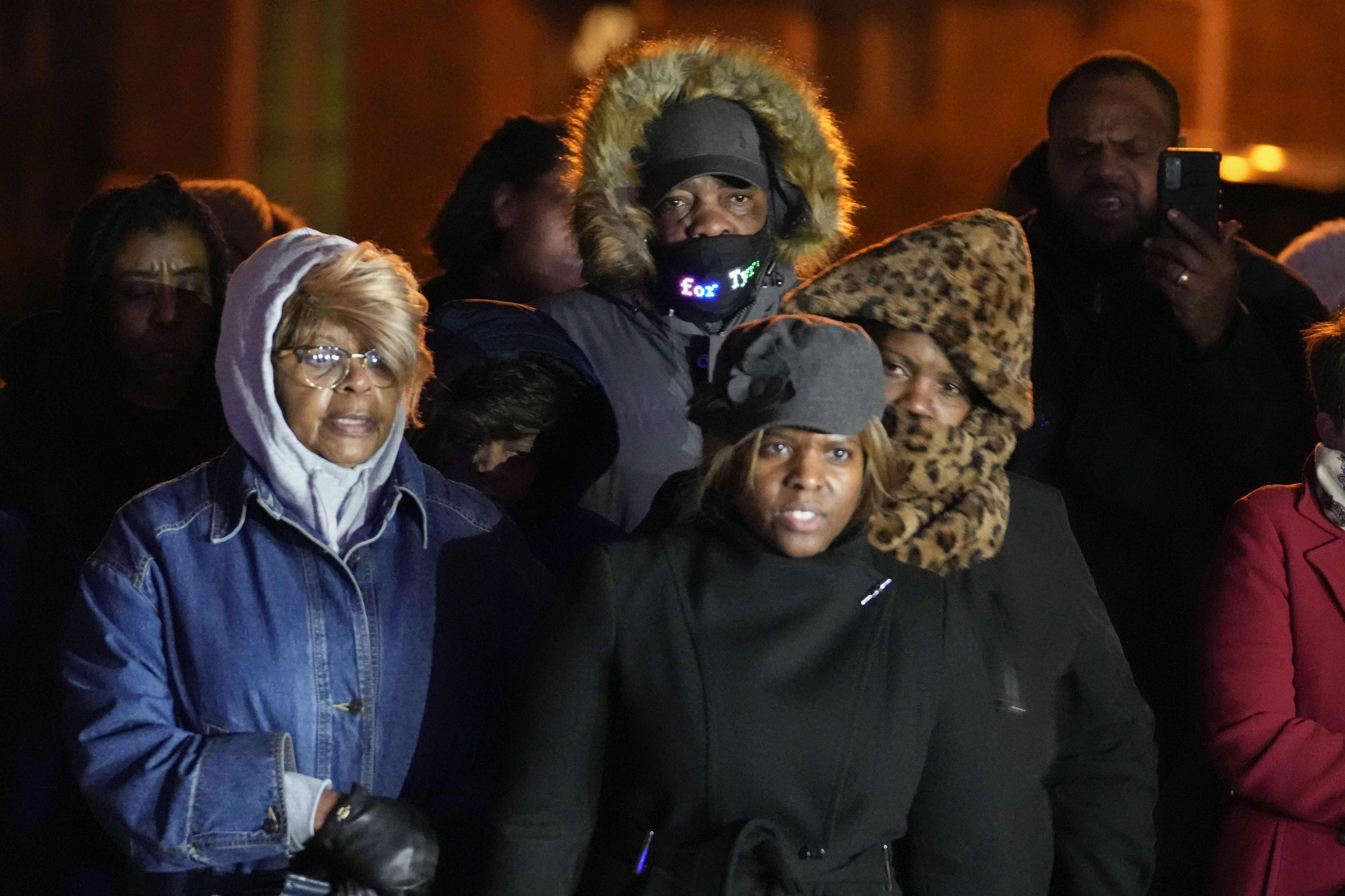 Rodney Wells, center, stepfather of Tyre Nichols, listens to speakers at a prayer gathering at the site where Nichols was beaten by Memphis police officers, and later died from his injuries, in Memphis, Tenn., Monday.
