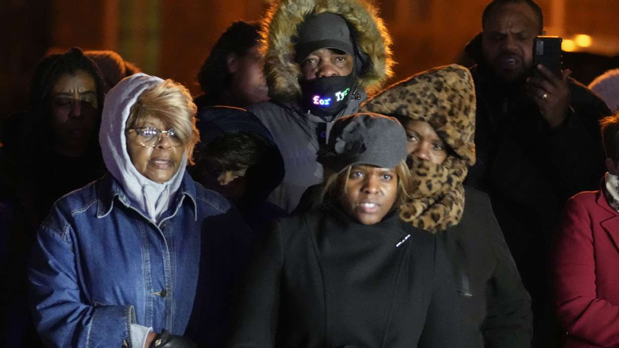 Rodney Wells, center, stepfather of Tyre Nichols, listens to speakers at a prayer gathering at the site where Nichols was beaten by Memphis police officers, and later died from his injuries, in Memphis, Tenn., Monday.