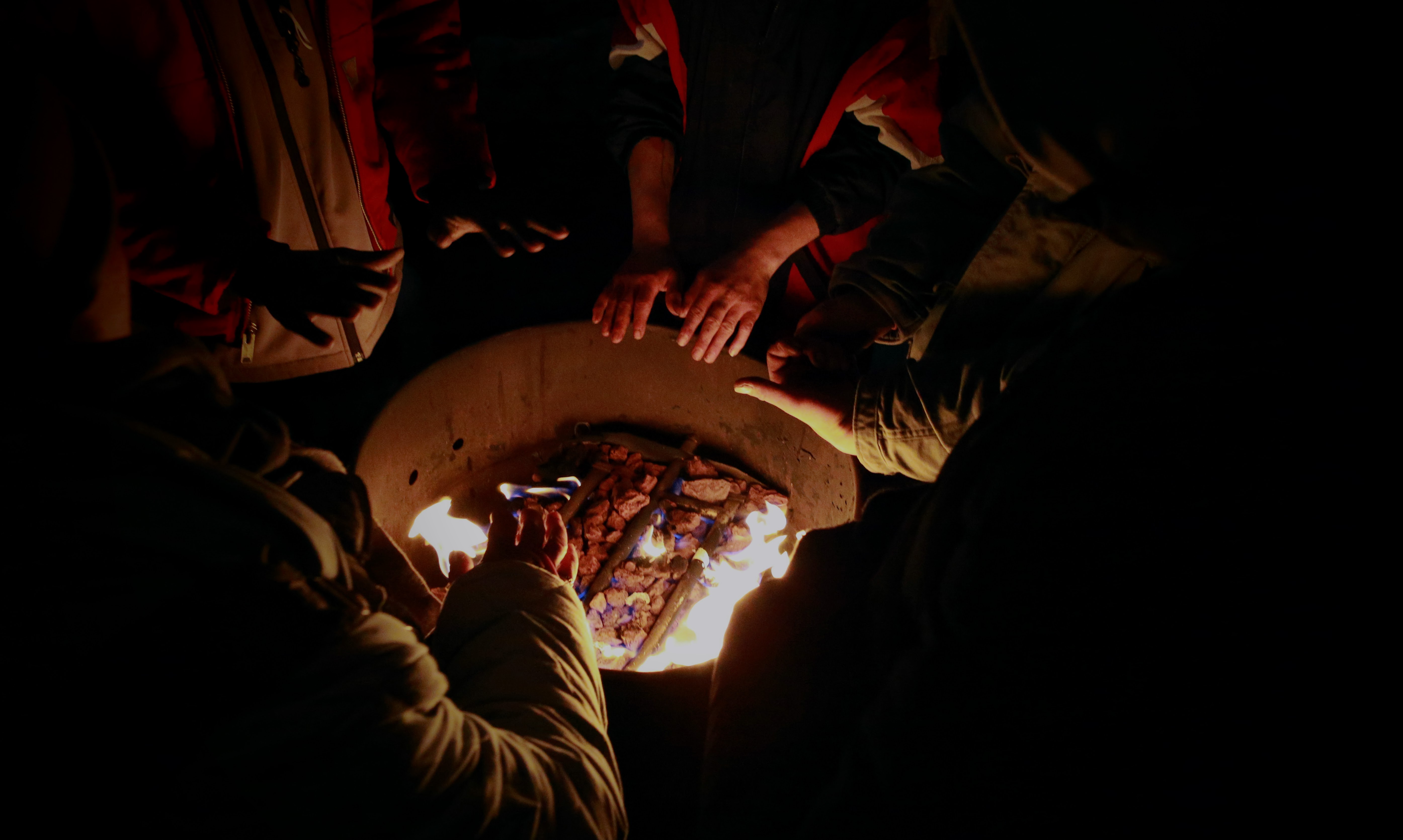 Unsheltered individuals seek warmth in the makeshift warming tent provided by advocates during bitter cold temperatures on Monday.