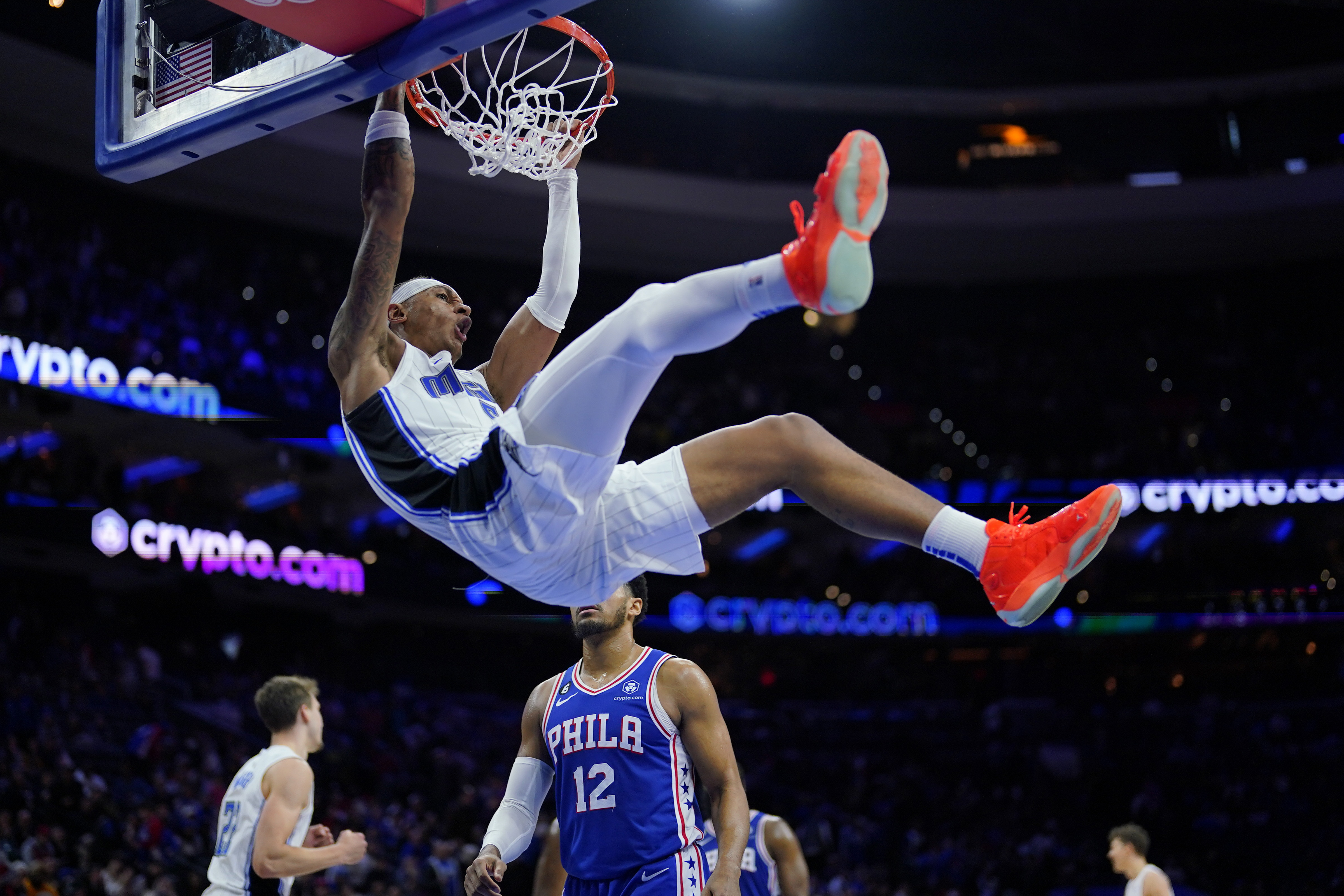 Orlando Magic's Paolo Banchero, top, dunks during the second half of an NBA basketball game against the Philadelphia 76ers, Monday, Jan. 30, 2023, in Philadelphia. 