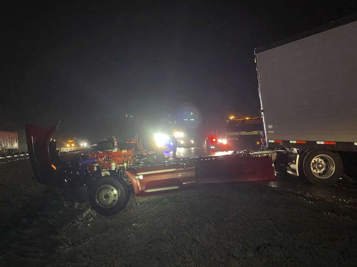This photo provided by the Forrest City, Ark., Fire Department shows a botched tractor trailer involved in a crash on Interstate 40, at mile marker 254, about 13 miles from the Forrest City exit on Tuesday morning.