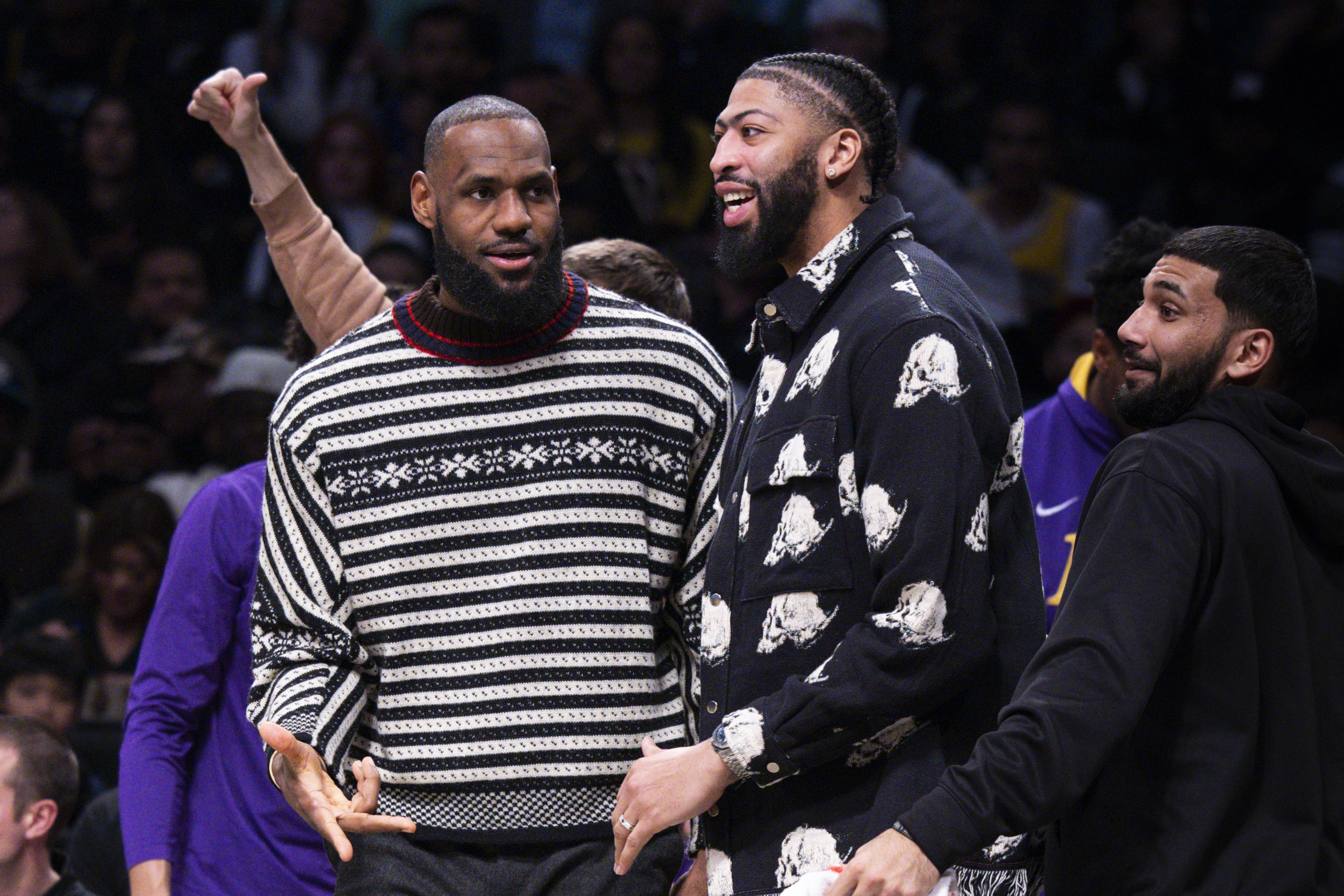 Los Angeles Lakers forward LeBron James, left, and forward Anthony Davis look on from the bench during the second half of an NBA basketball game against the Brooklyn Nets, Monday, Jan. 30, 2023, in New York.