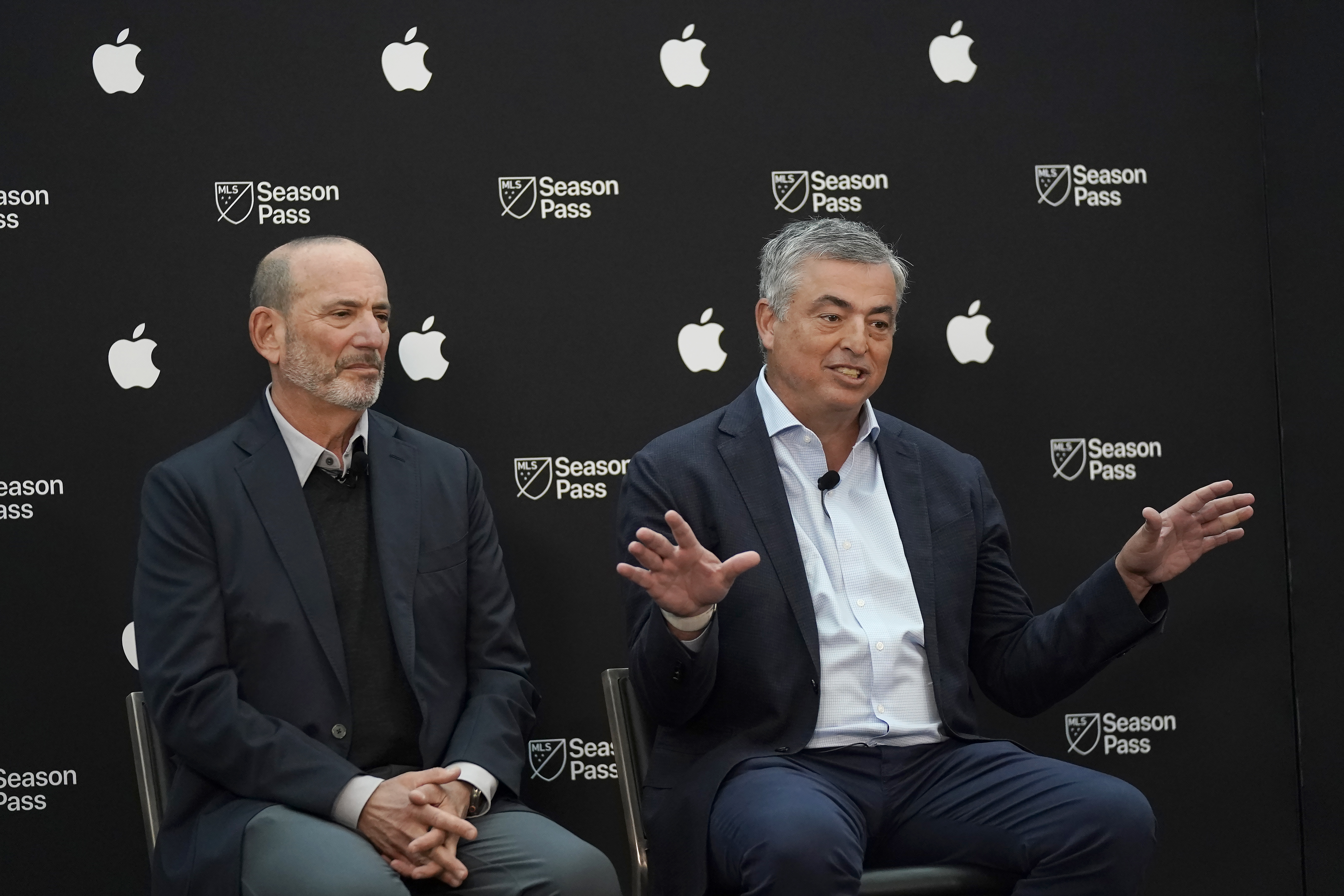 Apple senior vice president of services Eddy Cue, right, speaks next to Major League Soccer Commissioner Don Garber during a MLS Season Pass and Apple TV talent announcement at MLS soccer media day in San Jose, Calif., Tuesday, Jan. 10, 2023. 