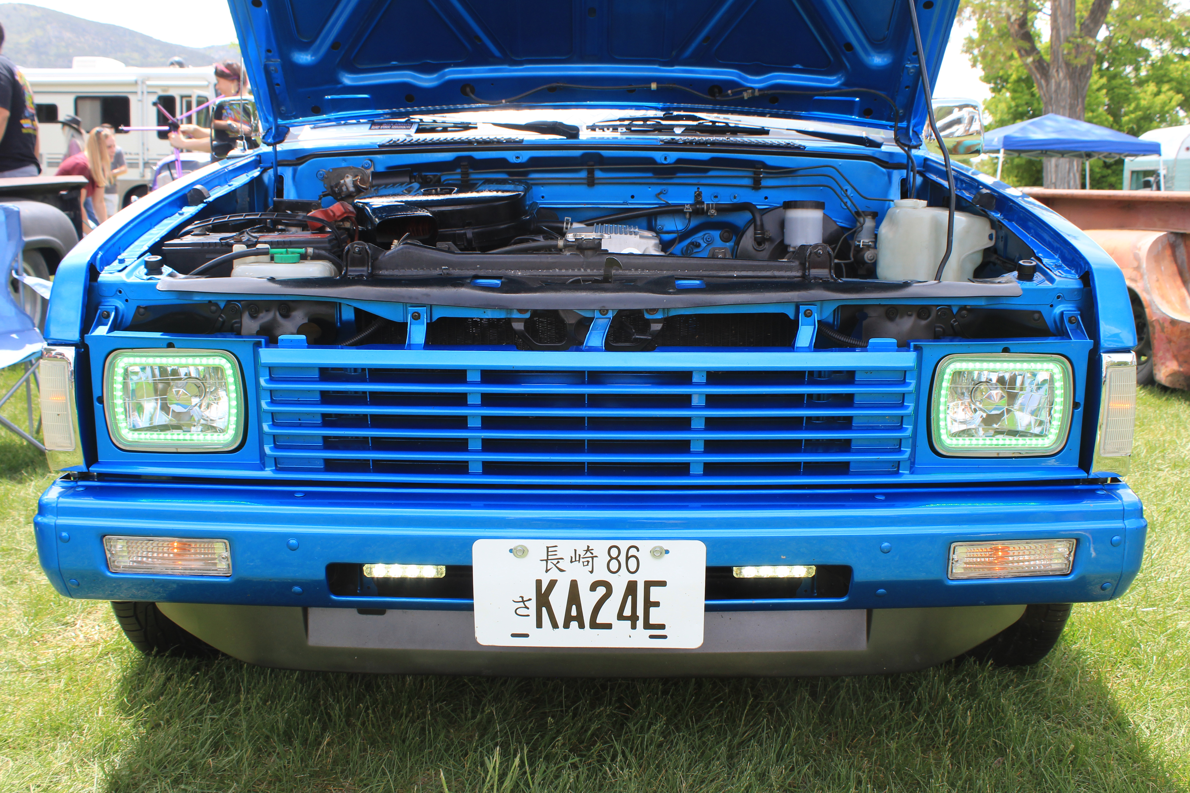 Samuel Edwards' 1986 Nissan Hardbody truck at the Rat Fink Car Show in Manti June 2022. Front plate is its new engine designation.