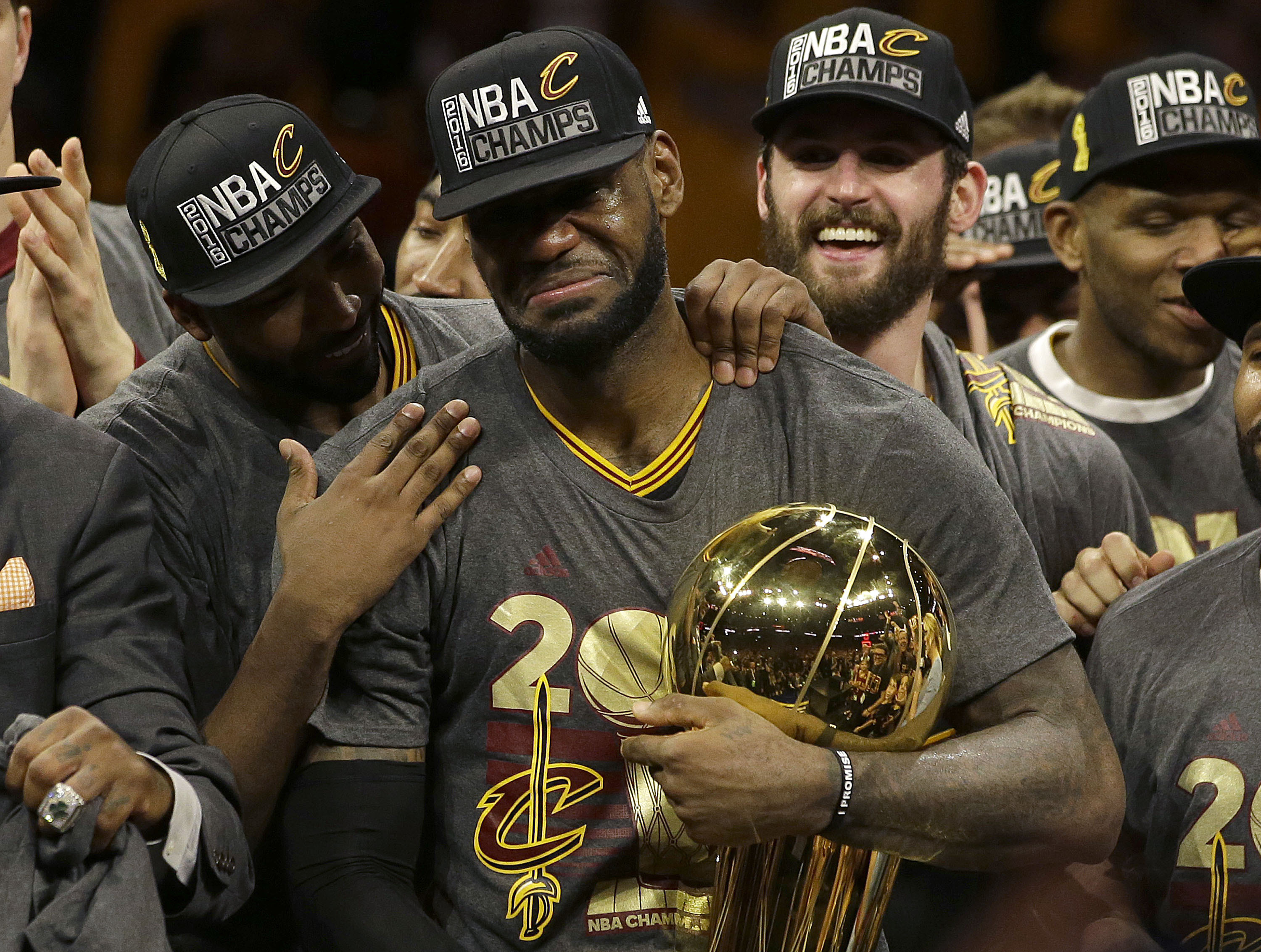 FILE -Cleveland Cavaliers forward LeBron James, center, celebrates with teammates after Game 7 of basketball's NBA Finals against the Golden State Warriors in Oakland, Calif., Sunday, June 19, 2016. LeBron James is about to pass Kareem Abdul-Jabbar as the NBA's career scoring leader. The AP is looking back at some of his top games along the way. 