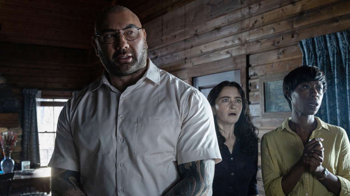 Dave Bautista, Abby Quinn and Nikki Amuka-Bird in director M. Night Shyamalan's film "Knock at the Cabin."