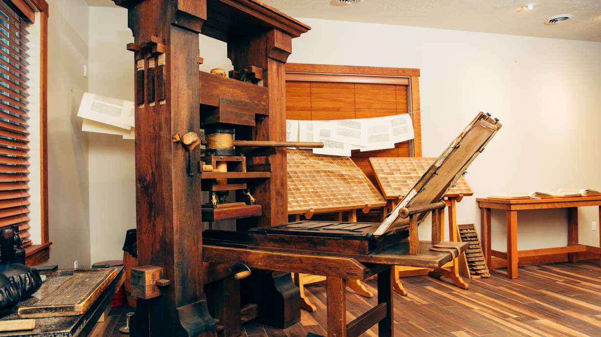 The Crandall Printing Museum just opened in Alpine and has four functional printing presses on display. The Gutenberg press is pictured here with printed pages of the Bible hanging to dry.