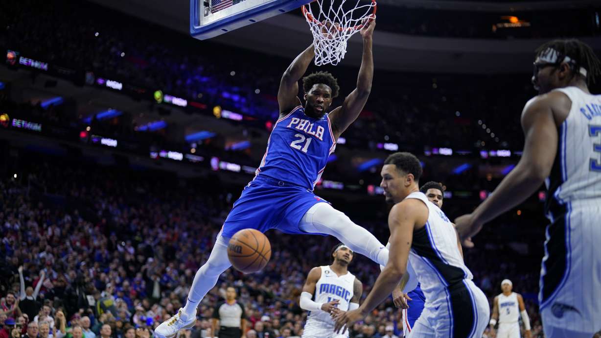 Philadelphia 76ers' Joel Embiid (21) dunks during the first half of an NBA basketball game against the Orlando Magic, Wednesday, Feb. 1, 2023, in Philadelphia.