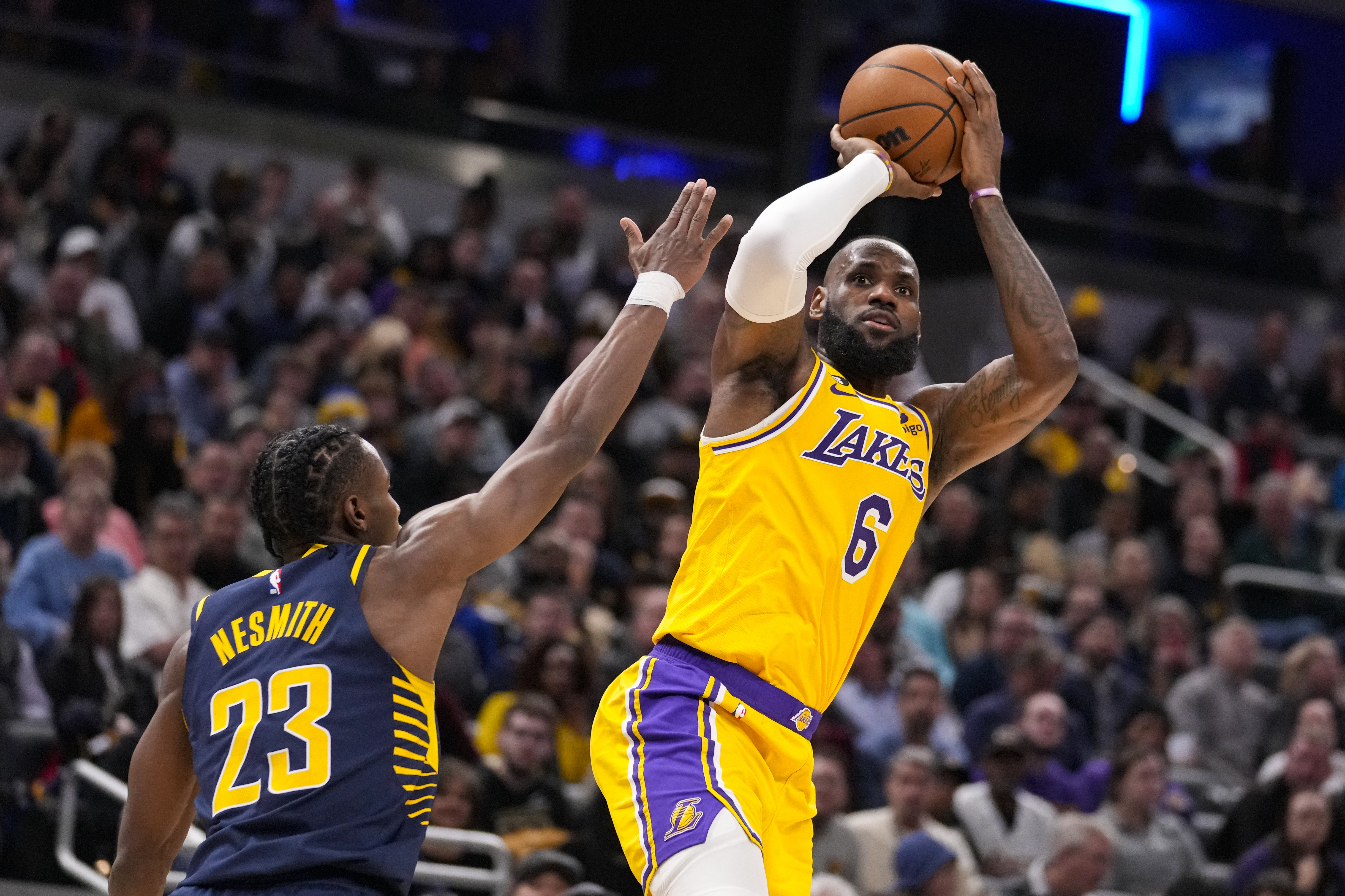 Los Angeles Lakers forward LeBron James (6) shoots over Indiana Pacers forward Aaron Nesmith (23) during the first half of an NBA basketball game in Indianapolis, Thursday, Feb. 2, 2023.
