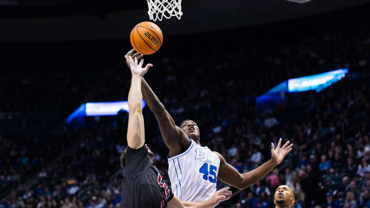 Brigham Young forward Fousseyni Traore (45) extends to grab a rebound during a NCAA basketball game against LMU at the Marriott Center in Provo on Thursday, Feb. 2, 2023.