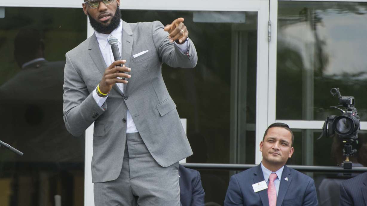 FILE -LeBron James speaks at the opening ceremony for the I Promise School in Akron, Ohio, Monday, July 30, 2018. The I Promise School is supported by the The LeBron James Family Foundation and is run by the Akron Public Schools. LeBron James is soon going to be in the NBA record books as the most prolific scorer ever. But for all his accomplishments on the basketball court, it is James’ ambitious pursuits off-the-court that may ultimately distinguish his legacy from other superstar athletes’.